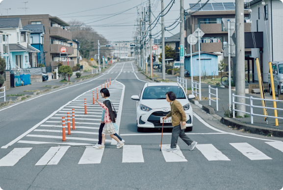 横断歩道を歩行者が渡っているイメージ